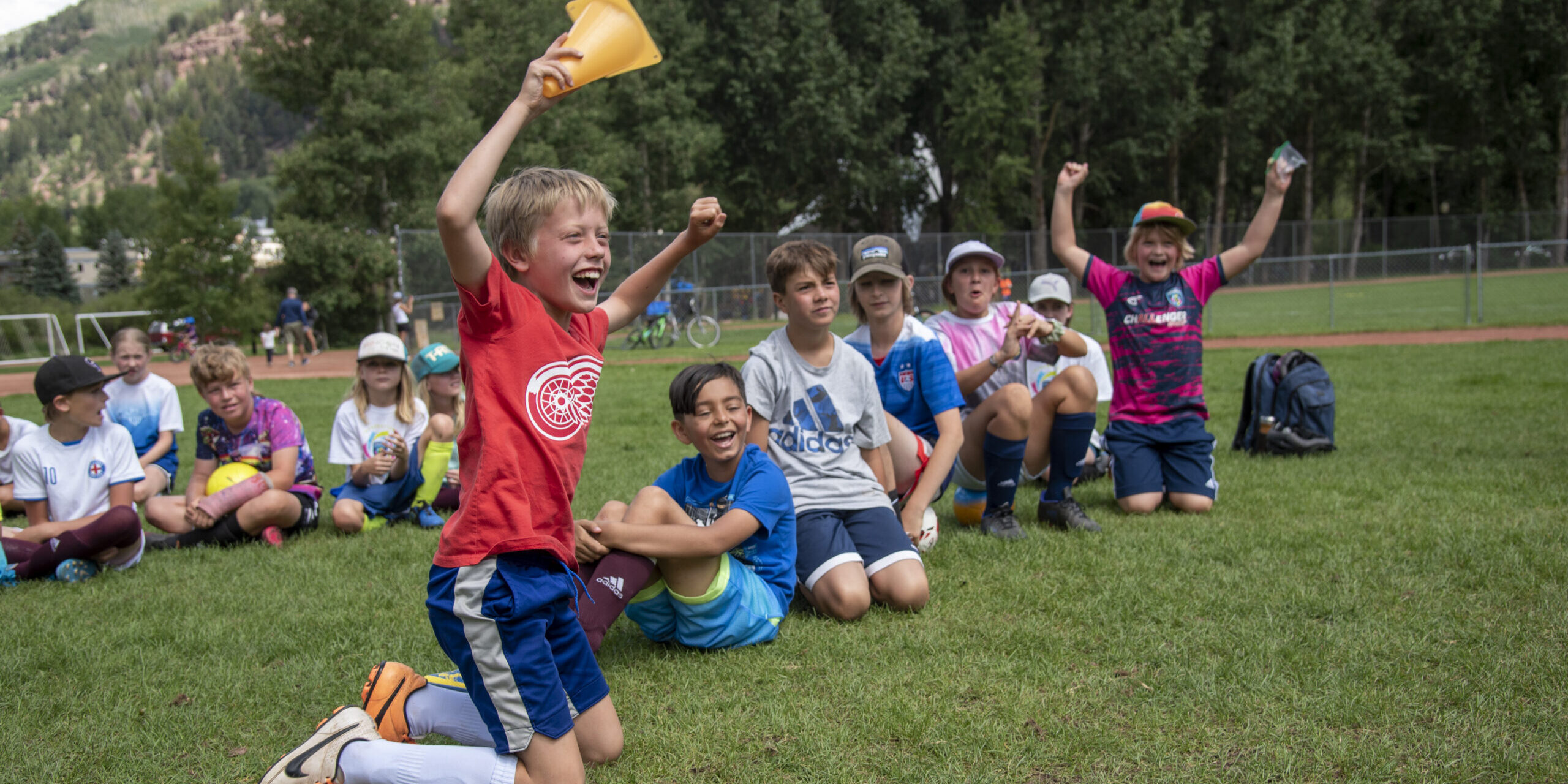 Happy kids cheering on camp